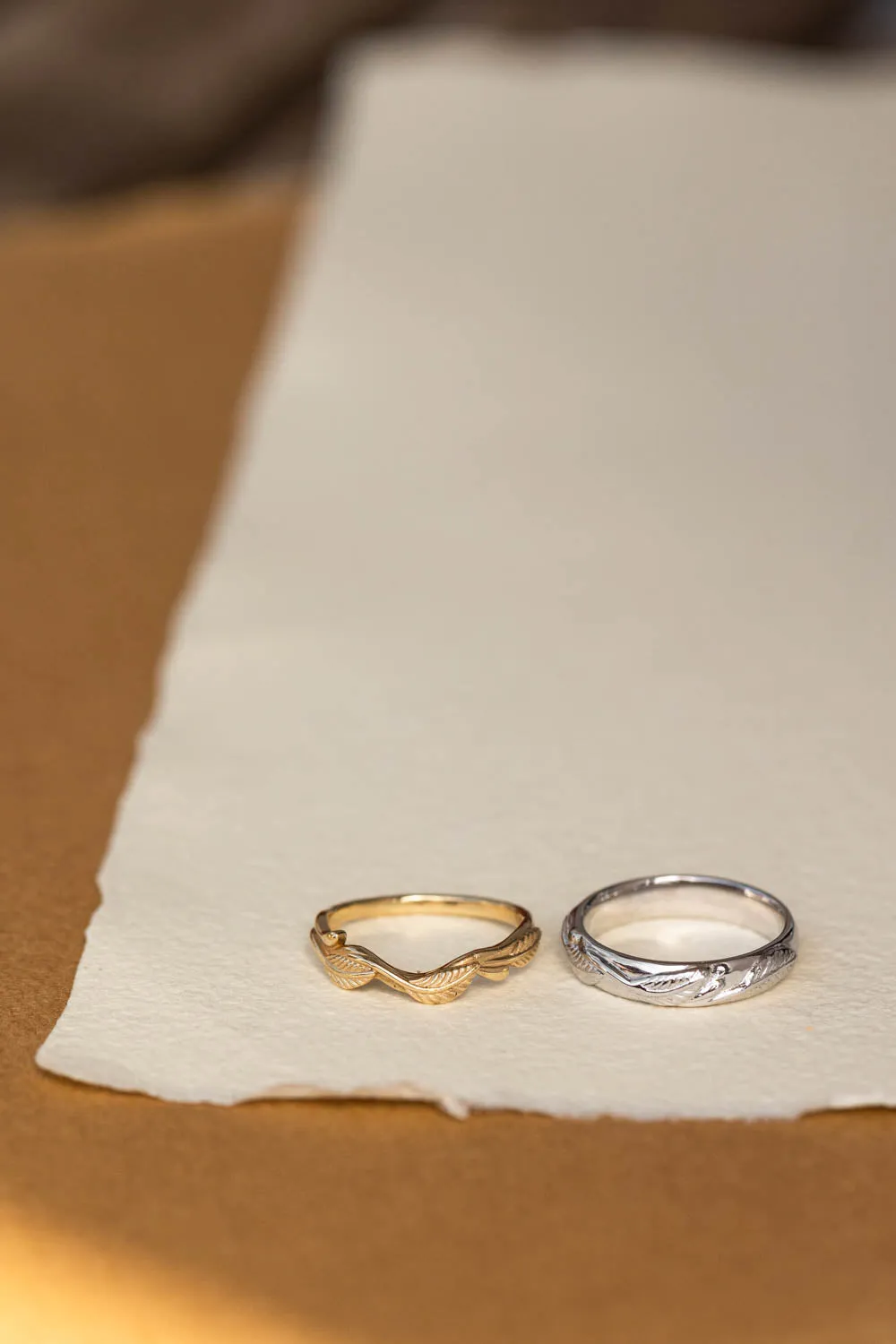 Wedding rings set for couples: white gold leaf band for him, gold twig band for her